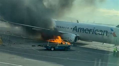 American Airlines plane catches fire after landing in Denver