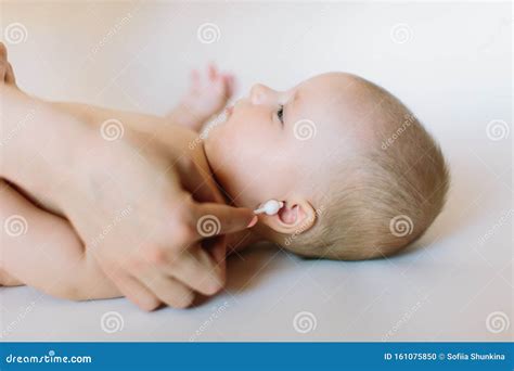 Mother Hand Cleaning Baby Ear on Towel Stock Photo - Image of mother ...