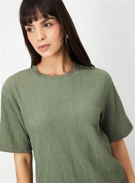 Buy Women Textured Regular Fit T-shirt Online at just Rs. 399.0 ...