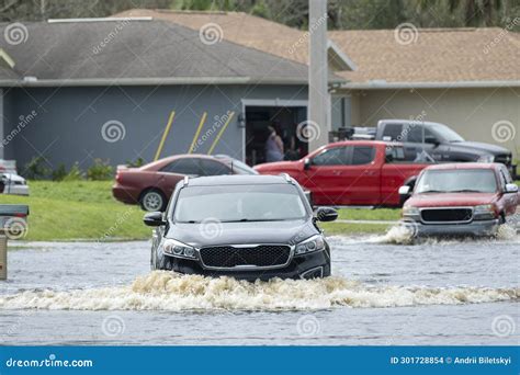 Hurricane Flooded Street with Moving Cars in Surrounded with Water ...