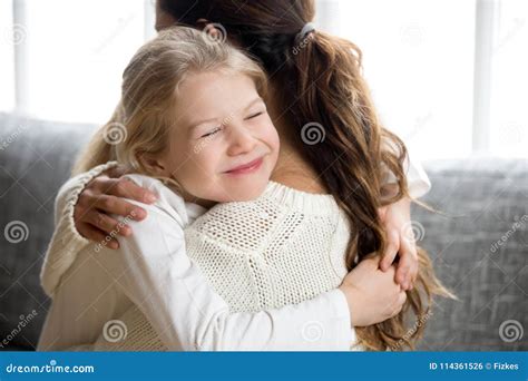 Cute Little Daughter Hugging Mother, Kids Love for Mom Concept Stock ...