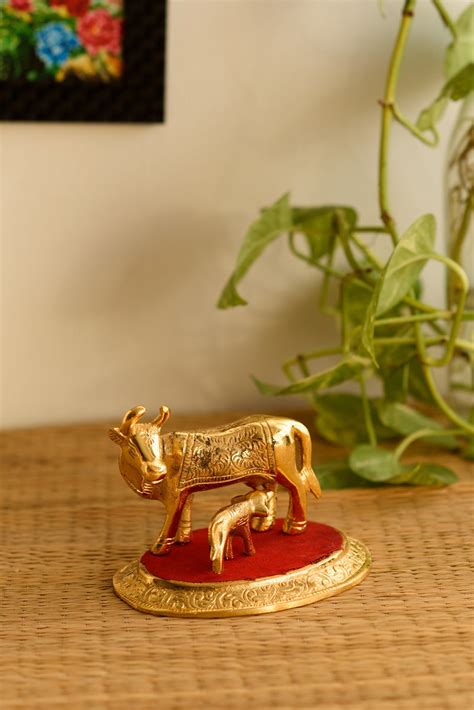 Golden Cow with Calf statue - eCraftIndia Online