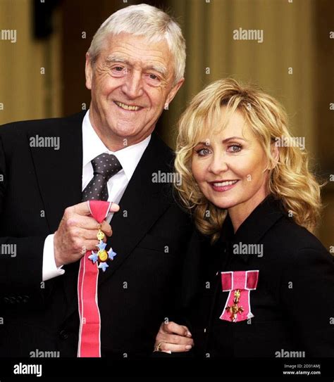 Chat show host Michael Parkinson who was awarded a CBE and singer Lulu ...