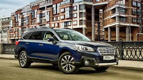 Download Rugged Yet Sophisticated Subaru Outback Under Clear Blue Sky Wallpaper | Wallpapers.com