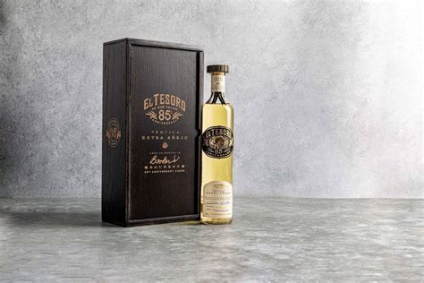 Download El Tesoro Tequila Bottle And Black Box Wallpaper | Wallpapers.com
