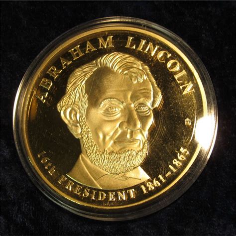 1278. Oversized copy of Abraham Lincoln Dollar – gold plated, marked TRIAL