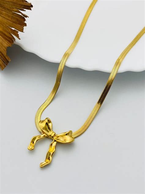 Buy Stylish Bow Pendant Golden Plated Snake Chain Necklace Online – The ...