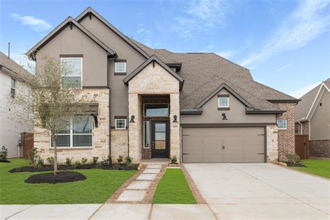 Rollins Plan at 6 Creeks in Kyle, TX by Chesmar Homes