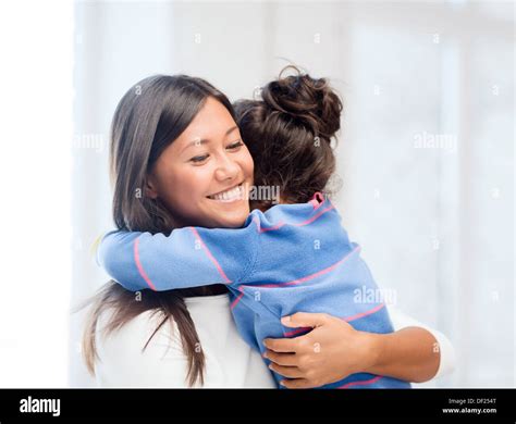 hugging mother and daughter Stock Photo - Alamy