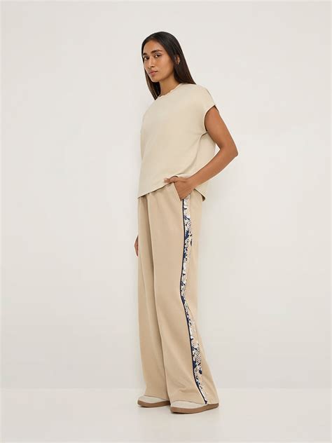 Buy LOV Beige Solid T-Shirt from Westside