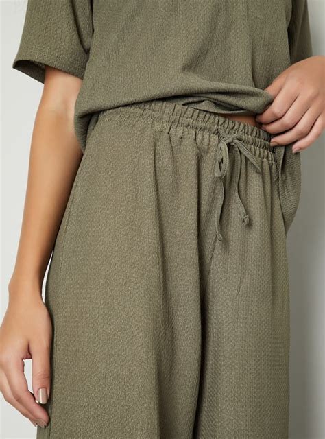 Buy Women Knit Textured Wide Leg Trousers Online at just Rs. 699.0 ...