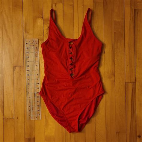 True red one piece, very flattering with plunge cut... - Depop