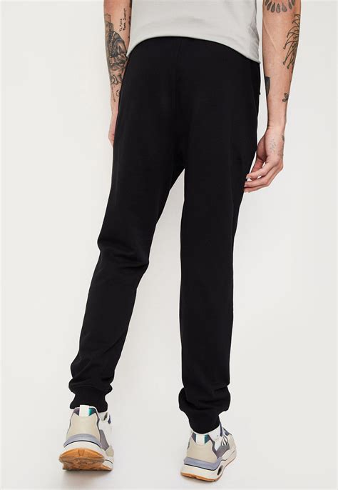 Buy Men Solid Elasticated Joggers Online at just Rs. 999.0 ...