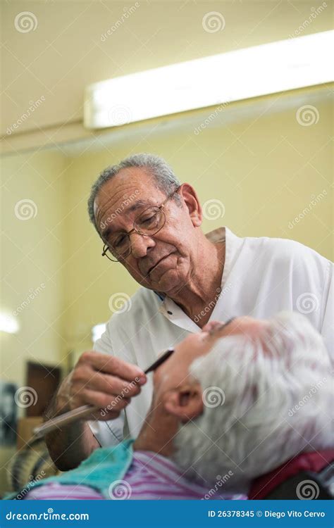 Barber with Razor Shaving Client in Barber Shop Stock Image - Image of ...