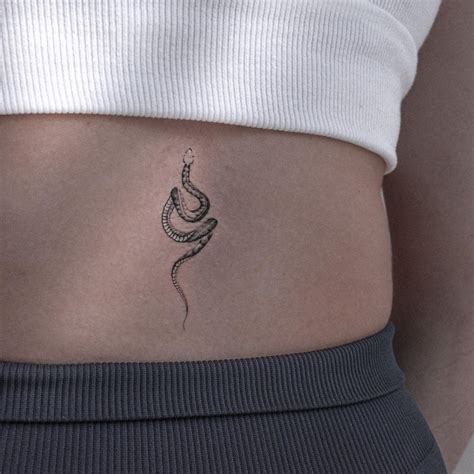 777 spine tattoo ideas female