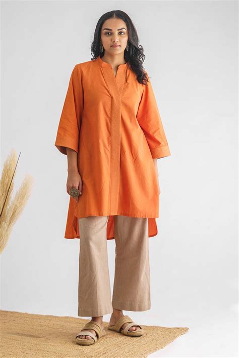 Shop Orange Stitch Detailed High-Low Tunic by MUSHIO at House of ...