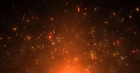Abstract orange fiery sparks and smoke from a bonfire with fire ...