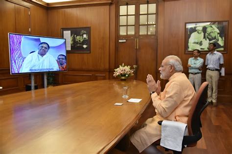 PM Narendra Modi interacts with Mata Amritanandamayi 'Amma' through ...