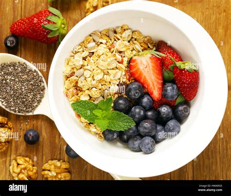 Breakfast cereals, granola with strawberries and blueberries Stock ...