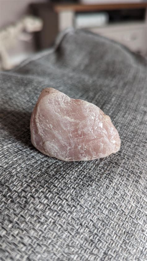 My stepdad found a pretty little chunk of rose quartz in our garden! The camera doesn't do the ...