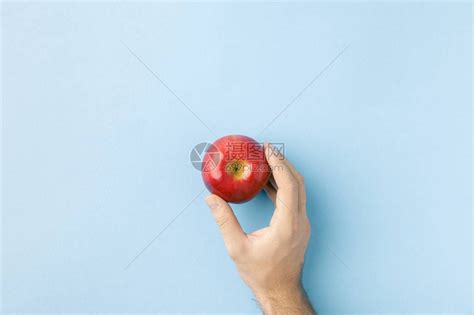 手握苹果的顶部视图高清图片下载-正版图片503618851-摄图网