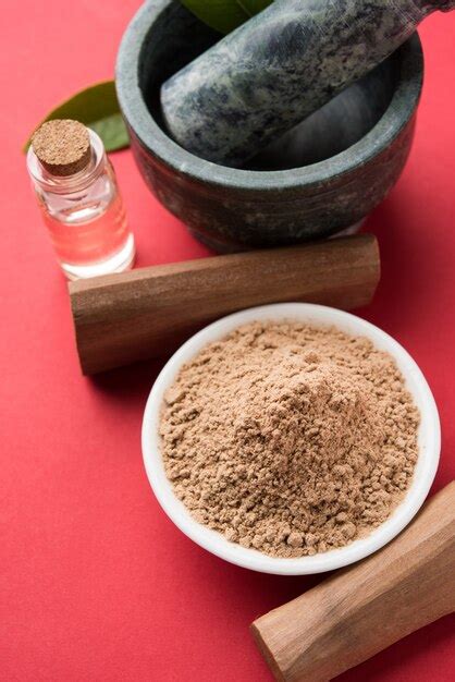 Chandan or sandalwood powder with sticks, traditional mortar, perfume ...