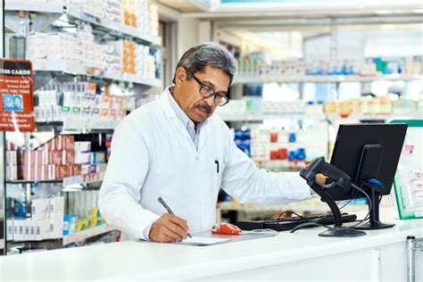 Pharmacist computer and writing for stock medicine and drugstore as ...