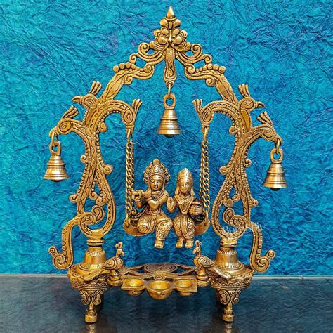 Buy Brass Radha Krishna Swing with Three Diyas 13.5 inch - Budhshiv.com