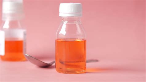 Cough syrup, liquid medicine, orange color 13826446 Stock Video at Vecteezy