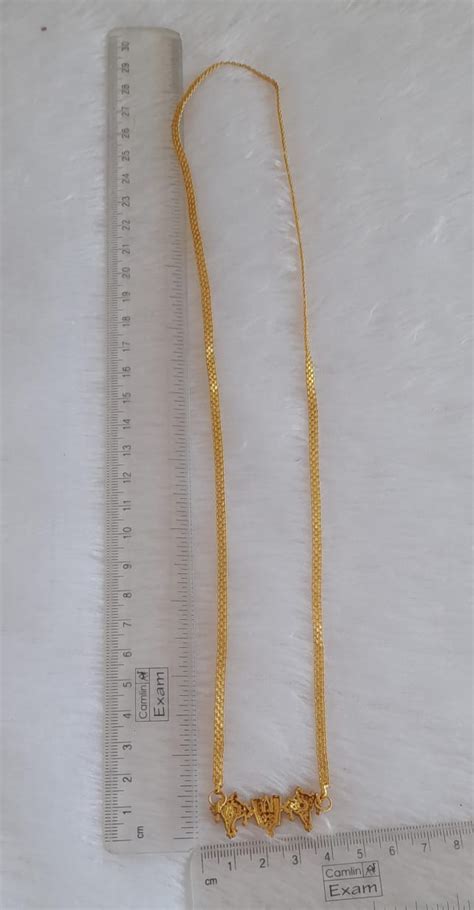 Gold tone 24 inches chain with cz ruby-green shanku-nama-chakra pendan ...