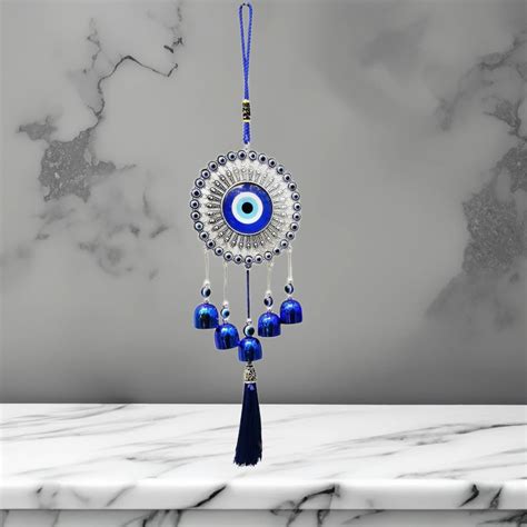 WARMINGO DE Evil Eye Wind Chime 3 Bells for Home & Office - Brings ...