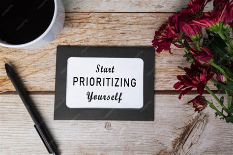 Premium Photo | Motivational quote on chalkboard frame and white flowers on on wooden desk start ...