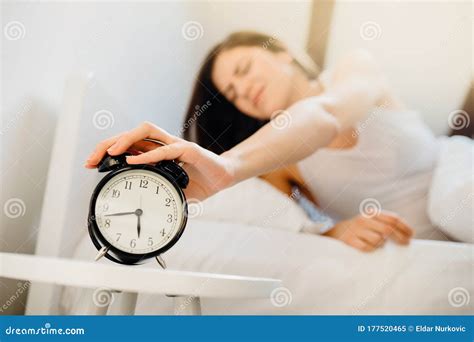 Alarm Clock Ringing.Woman Waking Up in Early Morning for Work.Sleeping Disorder.Tired Woman ...
