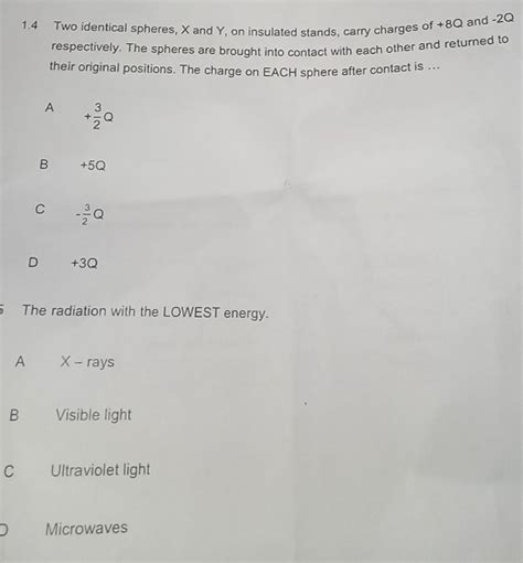 Solved: 1.4 Two identical spheres, X and Y, on insulated stands, carry ...