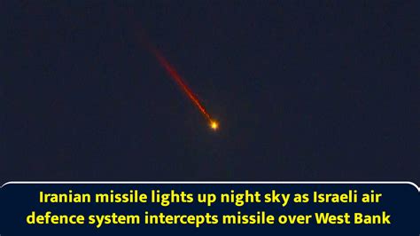 Iranian missile lights up night sky as Israeli air defence system ...