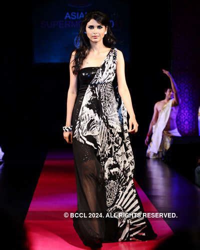 A contestant walks the runway at the Asian Super Model Contest 2011 ...