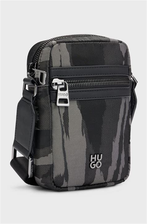HUGO - Stacked-logo reporter bag with seasonal pattern - Black