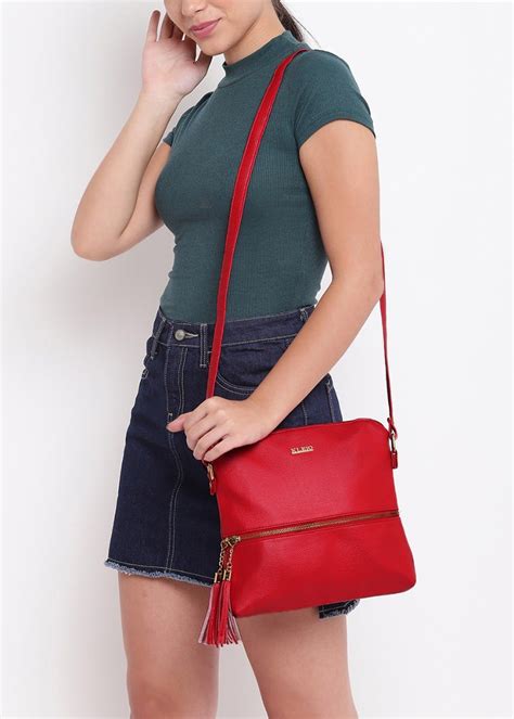 Get Tassel Charm Detail Solid Textured Cross-Body at ₹ 1087 | LBB Shop