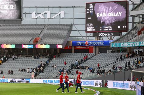 The players leave the field after three balls at Auckland ...
