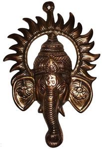 Blueship Black metal Ganesh Face with encircled Suraj ji wall decor ...