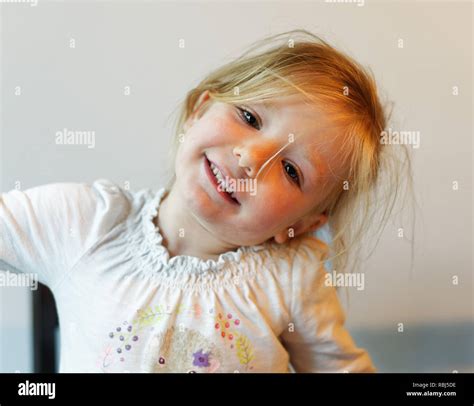 A portrait of a beautiful smiling four year old girl Stock Photo - Alamy