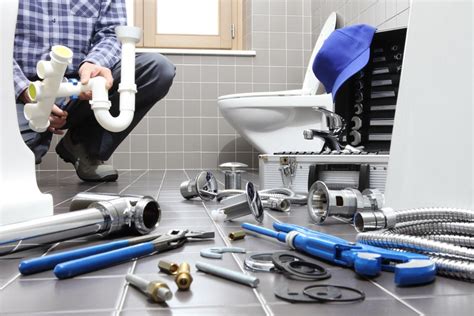 Elite Plumbing & Heating - Plumber working on sink repair