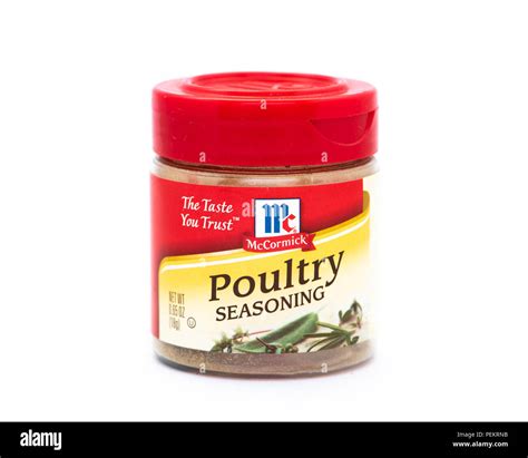 A clear plastic bottle of McCormick Poultry seasoning with a bright red ...