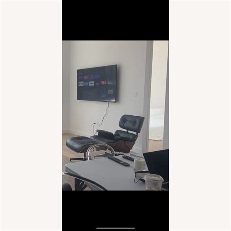 Eames Dupe Leather Swivel Accent Chair - AptDeco