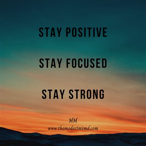 the words stay positive and stay focused are in front of an orange sky ...
