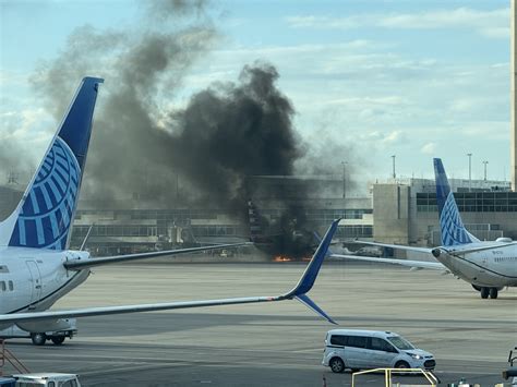 Passengers evacuated after American Airlines plane fire at Denver ...