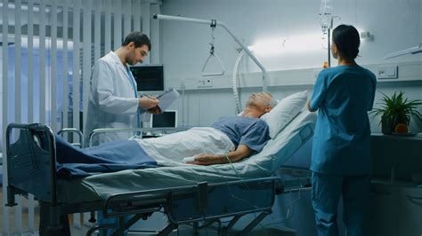 Sick Person In Hospital Bed