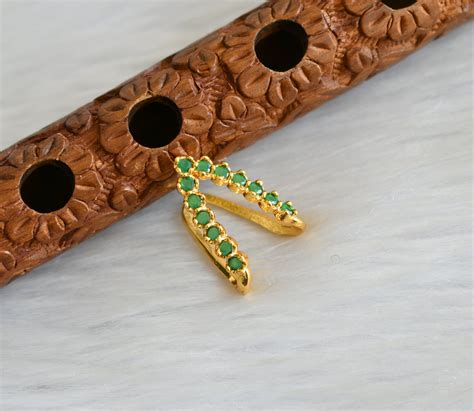 Gold tone green stone vanki finger ring dj-41633 – dreamjwell