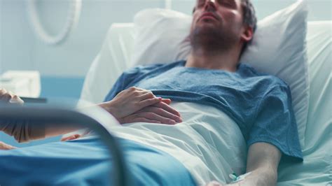 Sick Person In Hospital Bed