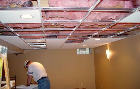 Installing Basement drop ceiling tiles: Installing acoustic tile is easy as long as you 'measure ...